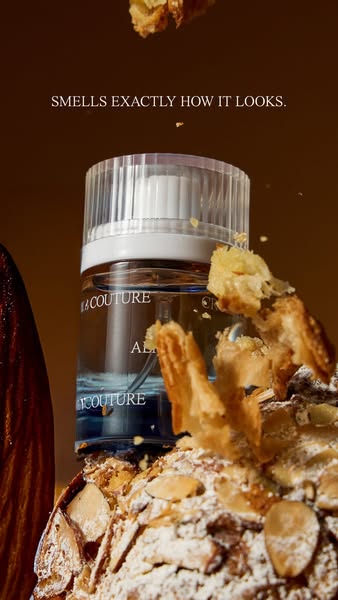An image promoting ALAÏA Paris fragrance. The image features the fragrance bottle on top of an almond croissant.