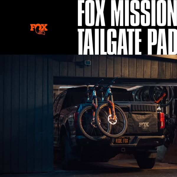 This ad showcases the Fox Mission Tailgate Pad on the back of a truck carrying two bikes. It emphasizes the brand's 