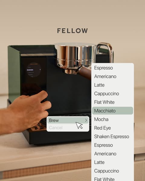 The ad demonstrates the user interface of a Fellow coffee machine, showcasing the touchscreen menu and options.
