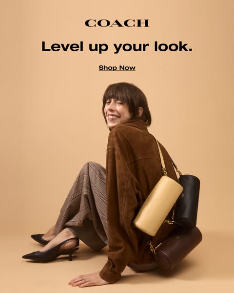 This image ad for Coach promotes their bags. The ad features a person wearing a brown jacket and patterned pants, sittin