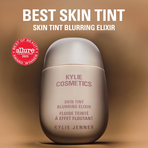 This ad showcases Kylie Cosmetics' Skin Tint Blurring Elixir, emphasizing its award-winning status. The layout is cl