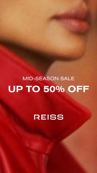 This ad is for Reiss. The image is a close up shot of a person wearing a red top, with the text "MID-SEASON SALE UP