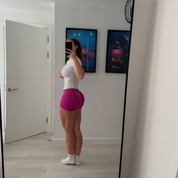 This ad features a woman in athletic wear showing off her figure.