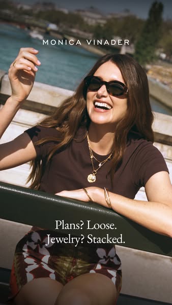This ad showcases a woman in a candid, outdoor setting wearing Monica Vinader jewelry. The ad emphasizes the idea of eff