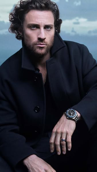 The ad features a celebrity wearing a luxury watch. The focus is on the watch's design and elegance, associating it 