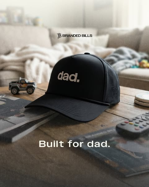 This image ad showcases a Branded Bills hat with the text "dad." embroidered on the front. The hat is placed o