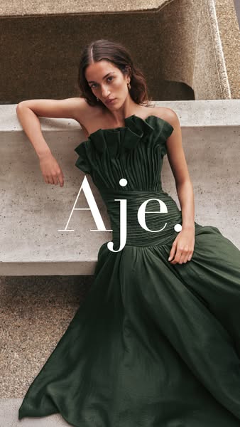 This ad features a woman wearing a green dress by Aje, leaning against a stone staircase or wall.