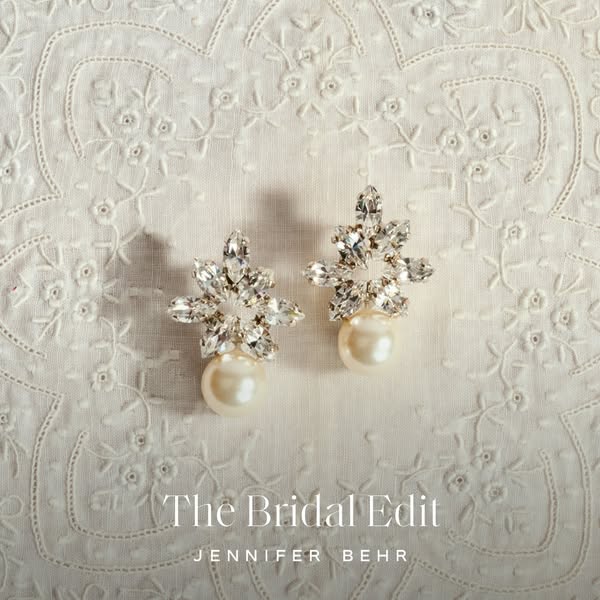 This image ad features two of Jennifer Behr's Bridal Edit earrings, displayed on an off-white backdrop.