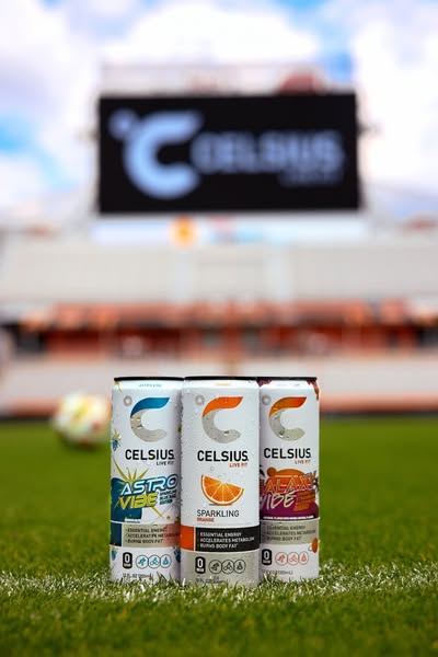 This ad showcases three flavors of Celsius energy drinks in front of a stadium, emphasizing their essential energy and m