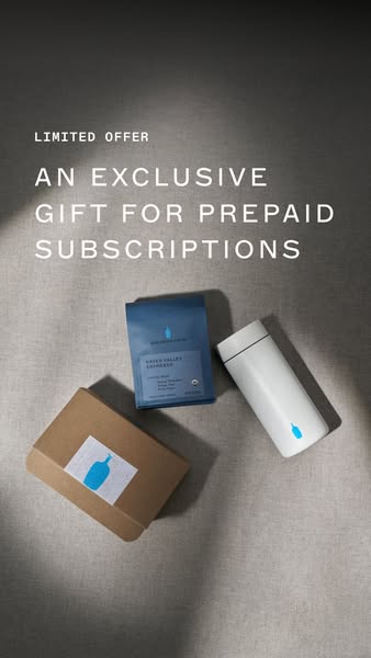 The ad features a special prepaid gift package by Blue Bottle Coffee, featuring a bag of Hayes Valley Espresso, a white 