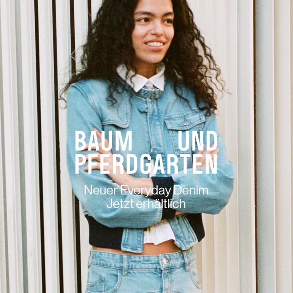 This ad features a woman wearing a matching blue denim jacket and pants, and promotes "Neuer Everyday Denim" f