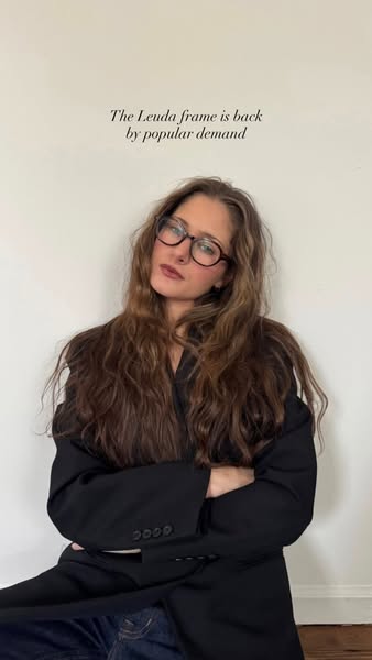 A lifestyle image promoting the Leuda glasses frame.