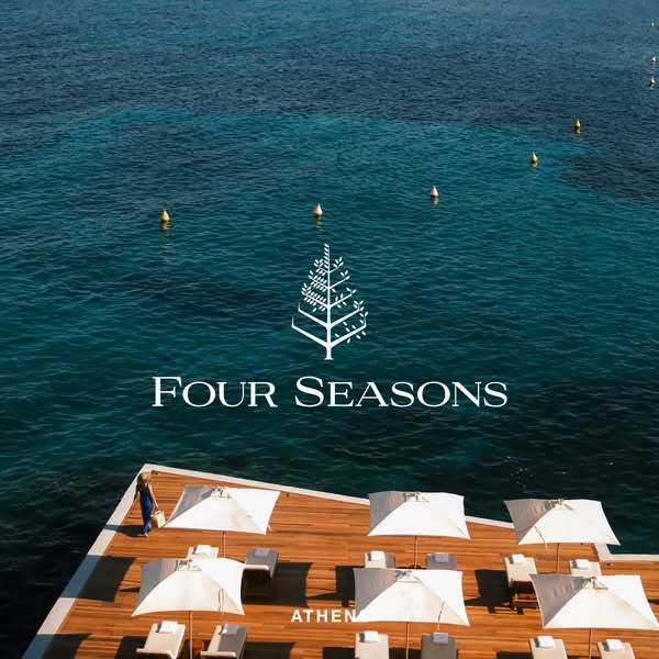 This ad is a static image promoting the Four Seasons hotel in Athens, showcasing its waterfront views, pool, and leisure
