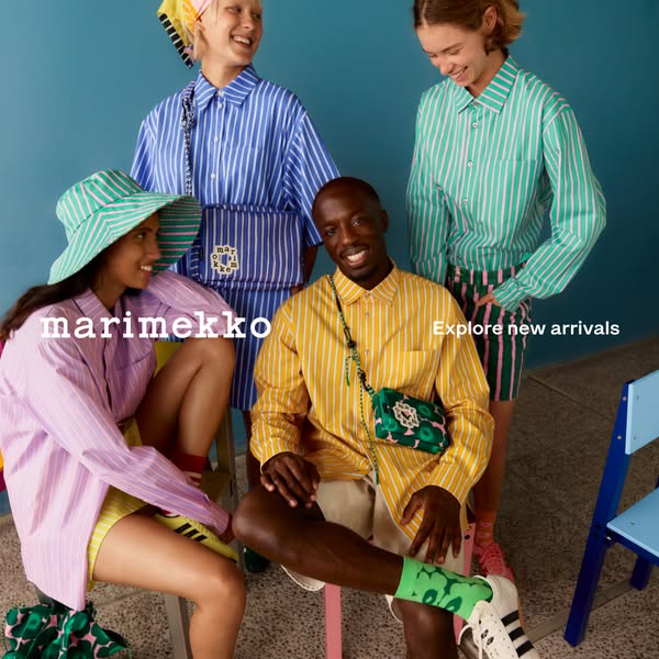 The ad features four models showcasing Marimekko clothing and accessories. The brand name and 'explore new arrivals&