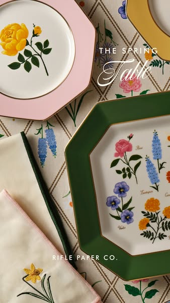 This image ad showcases various tableware pieces from Rifle Paper Co.'s Spring Table collection. The ad has an elega