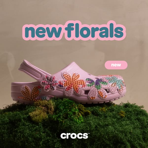 This image ad showcases a lavender Croc with floral Jibbitz on top of moss to promote the new floral styles.