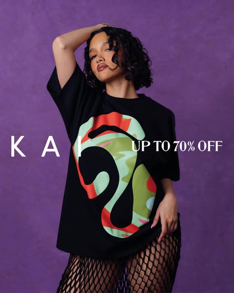 An ad featuring a model wearing a black t-shirt with a colorful design on it. The ad showcases the brand name "KAI&
