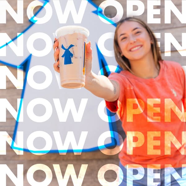 This image ad is for Dutch Bros Coffee. It features a female holding out a Dutch Bros iced coffee drink with an overlay 