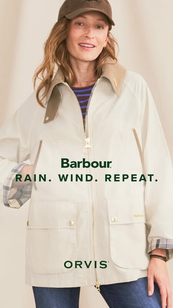 This ad shows a woman wearing a Barbour jacket in a neutral setting. The ad emphasizes the jacket's ability to withs