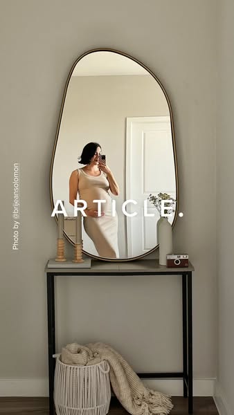 This ad features a pregnant woman taking a mirror selfie in front of an Article brand mirror. The ad is trying to show h