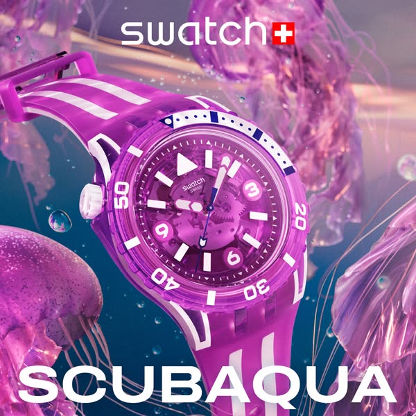 This image ad showcases a purple Swatch SCUBA AQUA watch surrounded by jellyfish.