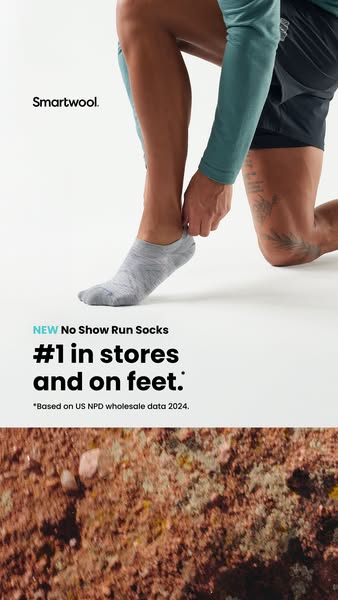 The ad features a close-up image of a person putting on a Smartwool no-show sock. The ad highlights that the sock is #1 