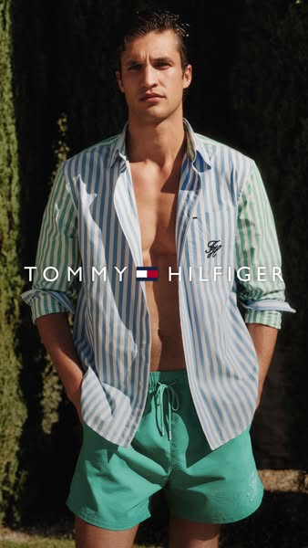 This ad features a male model wearing Tommy Hilfiger shirt and shorts with the brand name in the foreground.