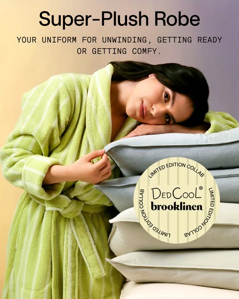 This ad features a woman in a plush striped robe reclining on a stack of folded Brooklinen pillows. The text emphasizes 
