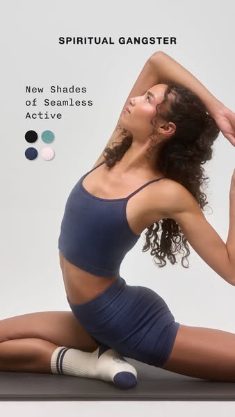 An ad for Spiritual Gangster apparel featuring a woman wearing their Seamless Active line, now available in new shades.