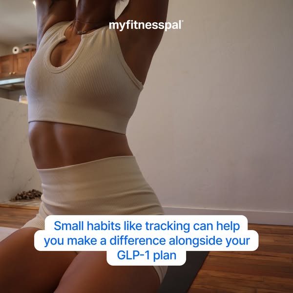 This ad features a woman wearing a workout set and standing in a room while the ad encourages viewers to track their hab