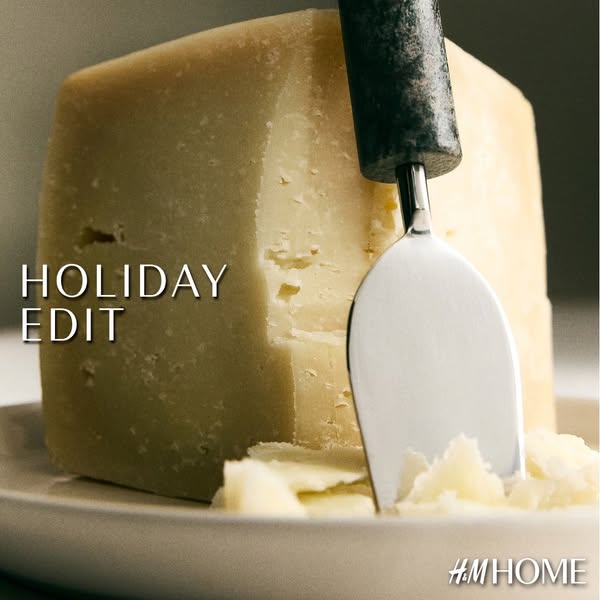 This ad from H&M Home features a large block of cheese on a plate, with a cheese knife sticking into it. The ad appe