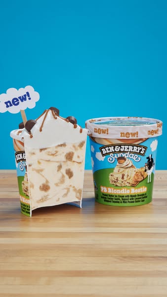 A studio shot displays two containers of Ben & Jerry's ice cream, focusing on the 'PB Blondie Bestie' fl