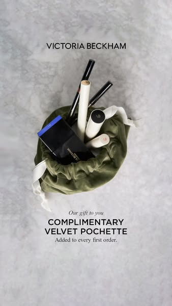 This image ad by Victoria Beckham promotes the brand and offers a complimentary velvet pochette with every first order.