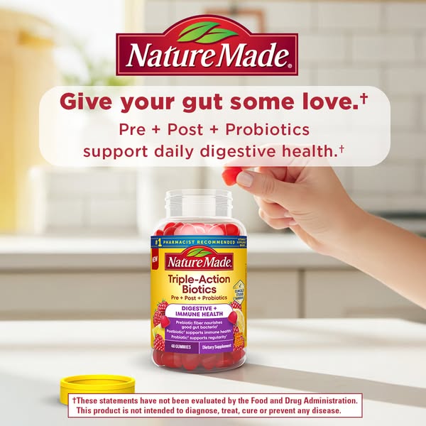 This image ad for Nature Made Triple-Action Biotics features the product container along with a hand reaching into the c