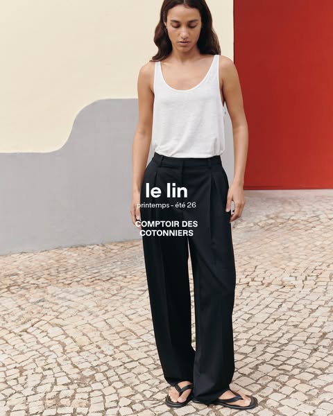 This ad showcases a woman wearing linen pants and a white tank top from Comptoir des Cotonniers. The ad promotes their s