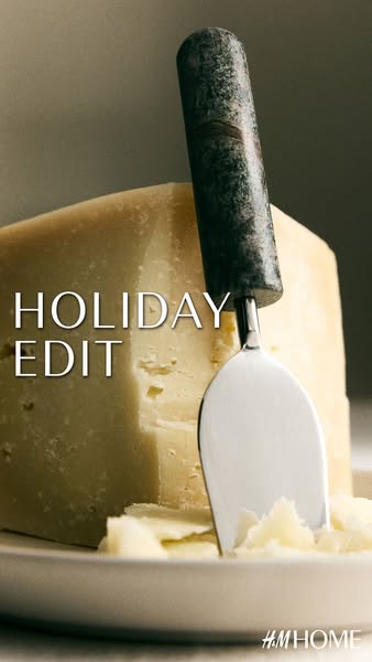 This ad for H&M Home features a cheese knife resting on a block of cheese.