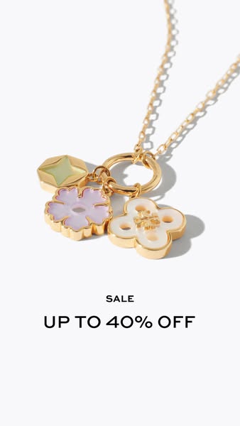 This is a studio shot of a Tory Burch necklace on sale for up to 40% off.