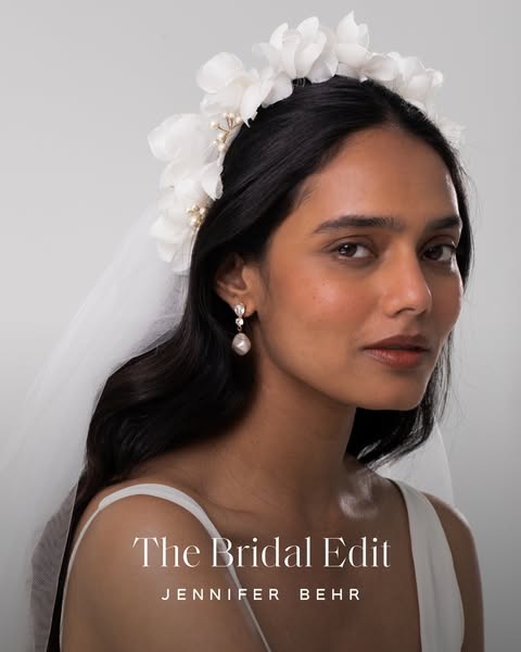 This image ad showcases Jennifer Behr's bridal collection, featuring a woman wearing the brand's floral headpiec
