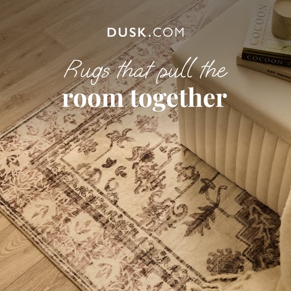 This image ad showcases rugs from Dusk.com, emphasizing their ability to 'pull the room together.' The ad featur
