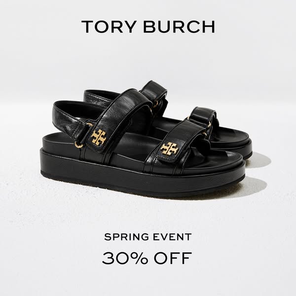 This ad promotes a Tory Burch spring event with a 30% off discount and features a pair of black platform sandals.