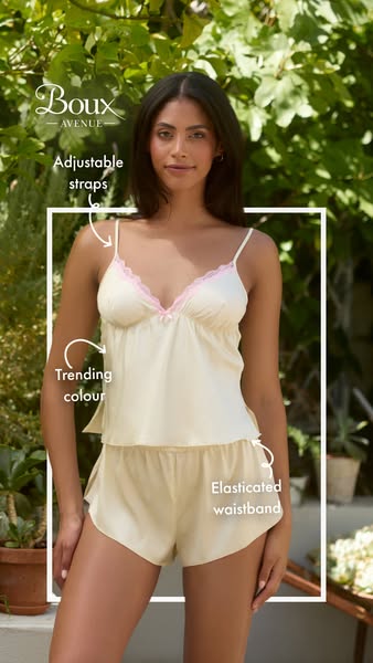 This ad showcases a woman wearing a matching set of Boux Avenue lingerie, a camisole and shorts, in a natural setting. T