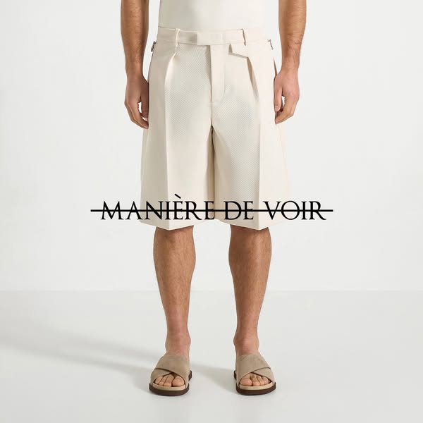 This ad features a model wearing beige shorts and sandals. The brand name is centered over the model's legs.