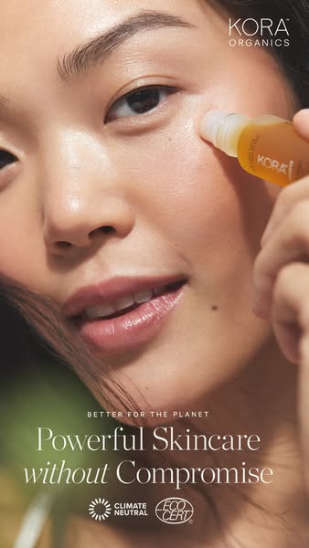 A close-up shot of a woman using a Kora Organics skincare product. The ad focuses on the environmental consciousness of 