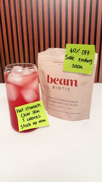 Image ad for beam BIOTIC featuring a product in a pouch, a beverage in a glass, and callouts to a discount and the benef