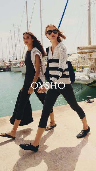 This Oysho ad features two models walking along a harborside, showcasing the brand's clothing and footwear. The ad e