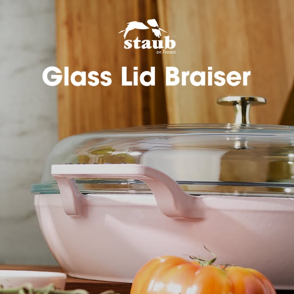 This ad showcases a Staub Glass Lid Braiser in a light pink color.