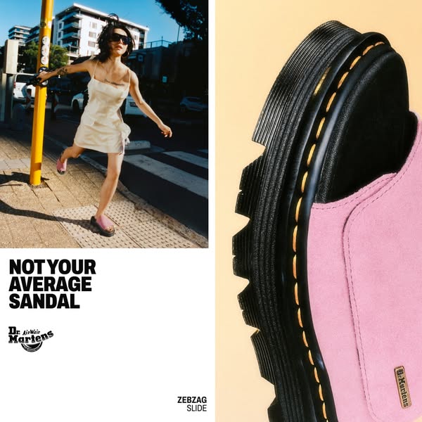 The image ad showcases a pair of pink Dr. Martens Zebzag Slide sandals. One side of the image features a woman walking o