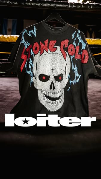 This image ad displays an oversized Loiter brand t-shirt hanging from a black hanger. The shirt features a large skull g