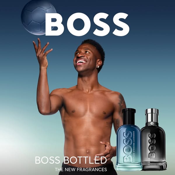 An advertisement featuring soccer player Vinícius Júnior endorsing Boss Bottled fragrances.