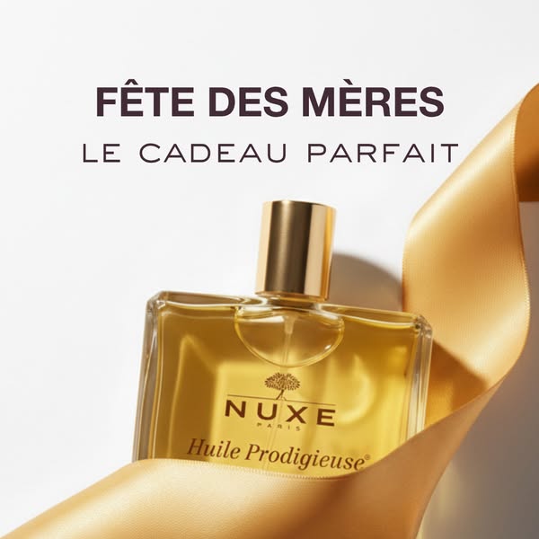 The ad features Nuxe's Huile Prodigieuse in celebration of Mother's Day. The product is presented in a gift-like